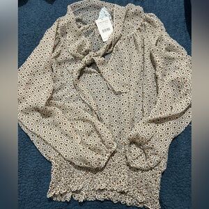 Free People see thru brown/Beige blouse. 
Brand new with tags